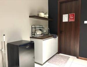 Kuhinja oz. manjša kuhinja v nastanitvi Kavenue Family Suite by CSE