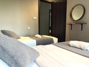 Postelja oz. postelje v sobi nastanitve Kavenue Family Suite by CSE