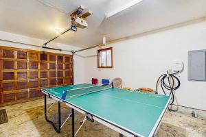 a room with a ping pong table in it at Falcon's Nest in Twin Rocks +18 photos
