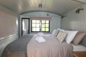 a bedroom with a large bed with towels on it at La Pina Verde in Estepona +72 photos