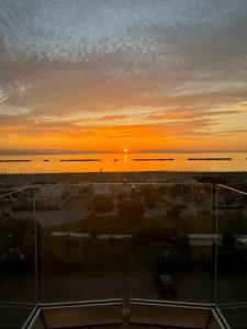 a view of the sunset from a building at Hotel Atlas in Cesenatico +43 photos