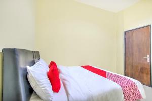 Ένα ή περισσότερα κρεβάτια σε δωμάτιο στο Hotel O Tebel 19