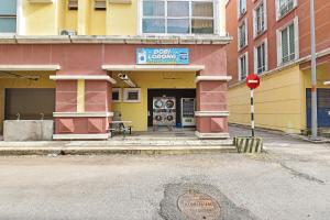a building with a do not disturb sign in front of it at Hotel O Sohotel in Klang