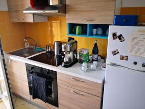 a kitchen with a sink and a refrigerator at B&B casa KaRa in Dolceacqua +12 photos