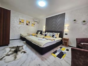 Postel nebo postele na pokoji v ubytování Villa Magnat + 37 fotografií