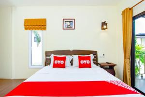 Postel nebo postele na pokoji v ubytování OYO 607 Nawang Resort