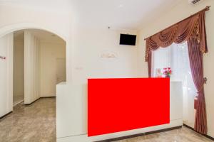 TV a/nebo společenská místnost v ubytování Super OYO 2771 D'soetta + 18 fotografií