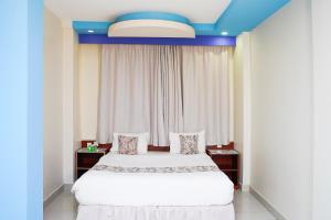 Letto o letti in una camera di Palette Muscat Al Bayrahaa