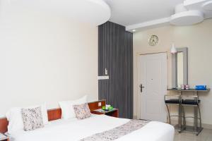 Letto o letti in una camera di Palette Muscat Al Bayrahaa