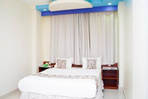 Letto o letti in una camera di Palette Muscat Al Bayrahaa