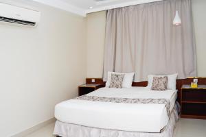 Letto o letti in una camera di Palette Muscat Al Bayrahaa