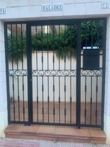 an iron gate in front of a building at Global Sun - Casa Pasco in Playa de Gandia