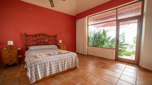 A bed or beds in a room at VILLA CANTARES Még 26 kép