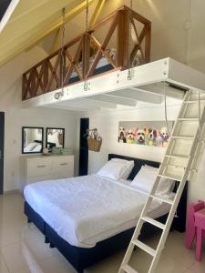 Postel nebo postele na pokoji v ubytování Yemaya Guesthouse Curaçao