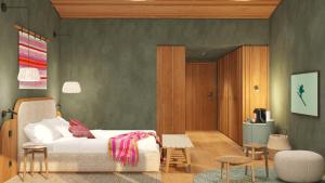 a bedroom with a bed and a table and chairs at Hotel Kristberg in Lech - New hotel with Spa - opening Dezember 4th, 2025 in Lech am Arlberg