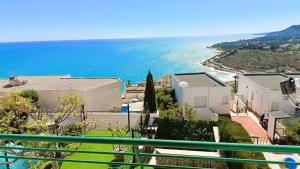 a view of the ocean from the balcony of a house at Ara Bela Duplex con jardin in Peniscola