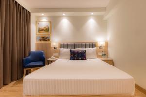 Posteľ alebo postele v izbe v ubytovaní Keys Prima by Lemon Tree Hotels, Pimpri, Pune