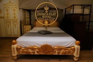 a bed with a sign that reads fiesta hat royal at Jessica Flat Malta Royal Guesthouse in Cospicua