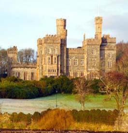 a large castle with trees in front of it at Woodside Guest House in Stornoway