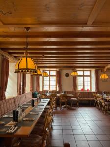 a dining room with a long table and chairs at Hotel Gasthof Zum Ochsen in Furtwangen