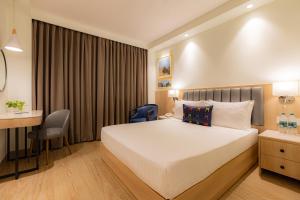 Posteľ alebo postele v izbe v ubytovaní Keys Prima by Lemon Tree Hotels, Pimpri, Pune