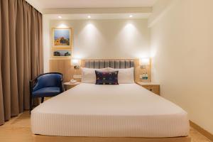 Posteľ alebo postele v izbe v ubytovaní Keys Prima by Lemon Tree Hotels, Pimpri, Pune