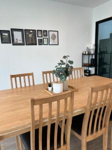 a dining room table with chairs and a wooden table at V Villa Khaoyai in Ban Nong Ka Cha +39 photos