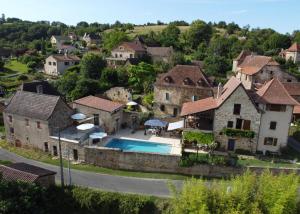 an aerial view of a house with a swimming pool at Henrietta's in Faycelles