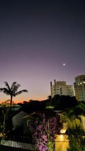 a view of a city at night with buildings at Pousada Madalena in Sao Paulo
