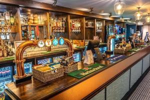 a bar with wicker baskets on the counter at Covesea View Silver Sands in Lossiemouth