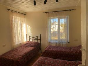Postel nebo postele na pokoji v ubytování Tumanyan Guesthouse