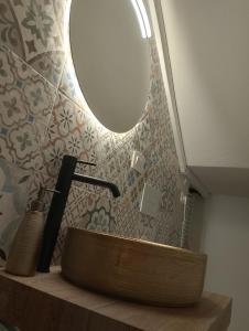 a bathroom with a wooden sink and a mirror at Valdidentro sweet home in Valdidentro +64 photos