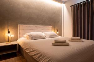 Posteľ alebo postele v izbe v ubytovaní CentralViewSuites