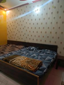 Postel nebo postele na pokoji v ubytování Maa janki paying guest house