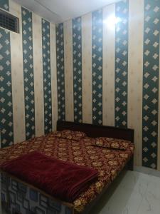 Postel nebo postele na pokoji v ubytování Maa janki paying guest house