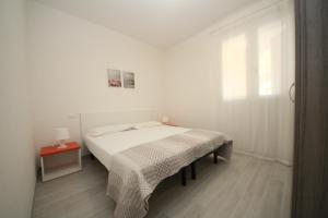 Postel nebo postele na pokoji v ubytování Villa Manu appartamento 02