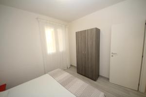 Postel nebo postele na pokoji v ubytování Villa Manu appartamento 02