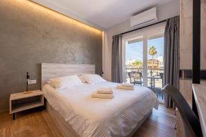 Posteľ alebo postele v izbe v ubytovaní CentralViewSuites