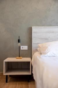 Posteľ alebo postele v izbe v ubytovaní CentralViewSuites