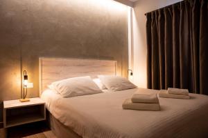Posteľ alebo postele v izbe v ubytovaní CentralViewSuites