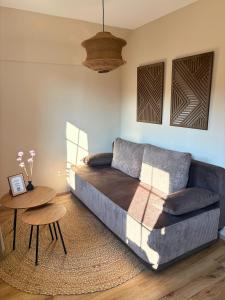 a living room with a couch and a table at Apartment Ikigai in Cochem