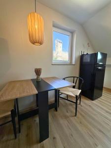 a dining room with a table and a chair at Apartment Ikigai in Cochem +13 photos