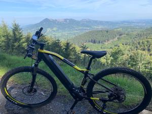 a bike parked on the side of a hill at AP Apartment's Zielony in Szczawno-Zdrój +6 photos