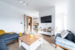 a living room with a couch and a coffee table at Novi Sad's Quiet Quarters in Novi Sad
