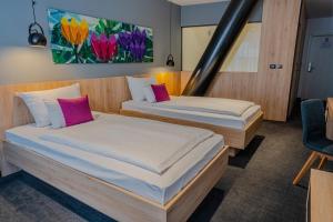 Posteľ alebo postele v izbe v ubytovaní Hotel Academia