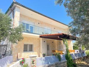 a brick house with an awning in front of it at Stonehouse-Pag in Povljana