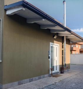 a balcony on the side of a building with a door at I Girasoli in San Martino In Strada