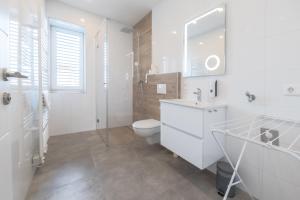 Koupelna v ubytování Amaria Downtown Aparthotel Villach + 37 fotografií