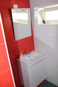 a bathroom with a sink and a mirror at Casa da Timenina Privates Rooms in São Brás de Alportel