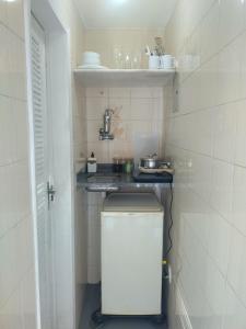 a small kitchen with a counter and a sink at Brota na Lapa in Rio de Janeiro